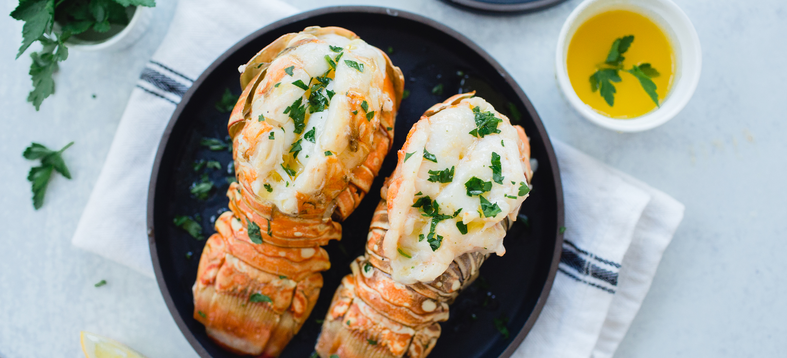 steamed lobster tails on a plate 